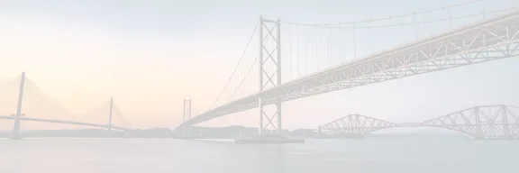 A view of the 3 forth bridges with a sunset in the background