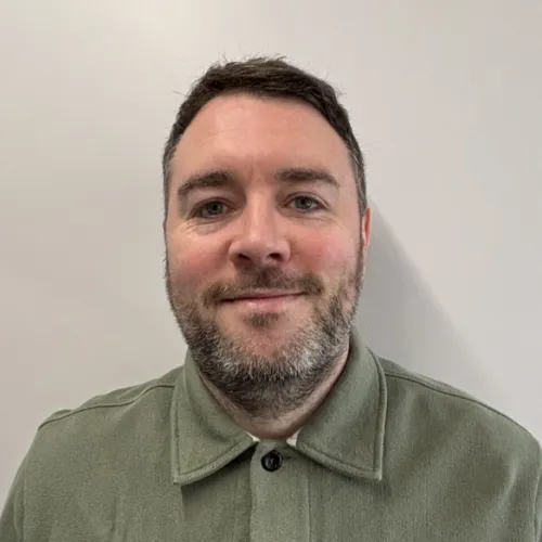 A portrait image of a male director 